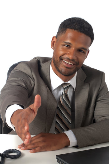 happy businessman offering a hand shake