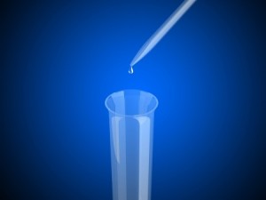 Pipette dripping into a test tube